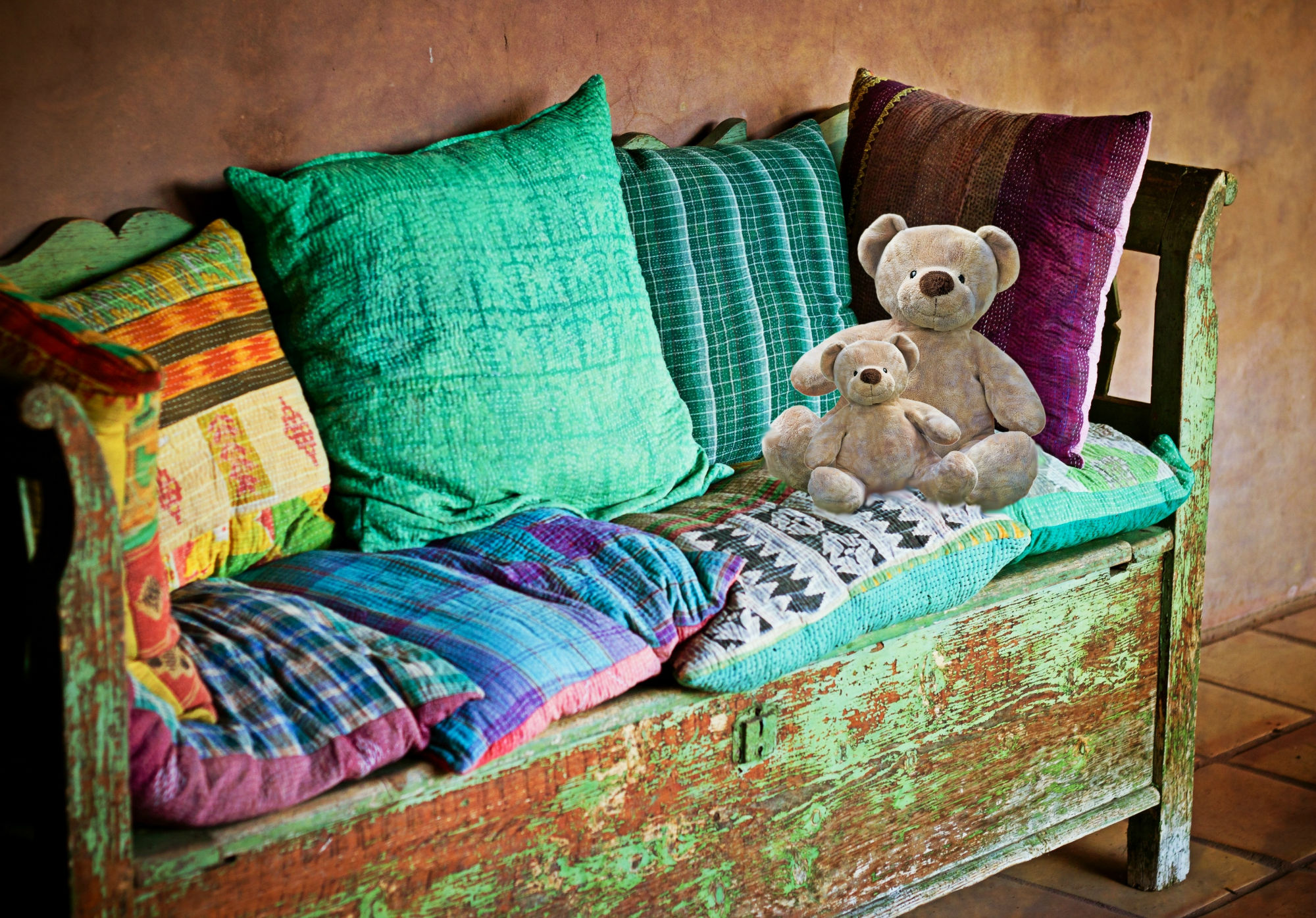 A Colourful Bed Bug Free Sofa with Pillows and Teddy Bears